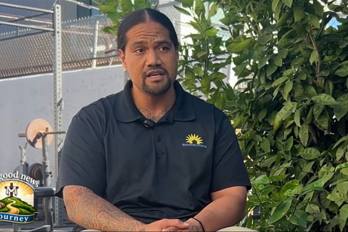 United Levao in a dark polo shirt, seated outdoors during an interview.